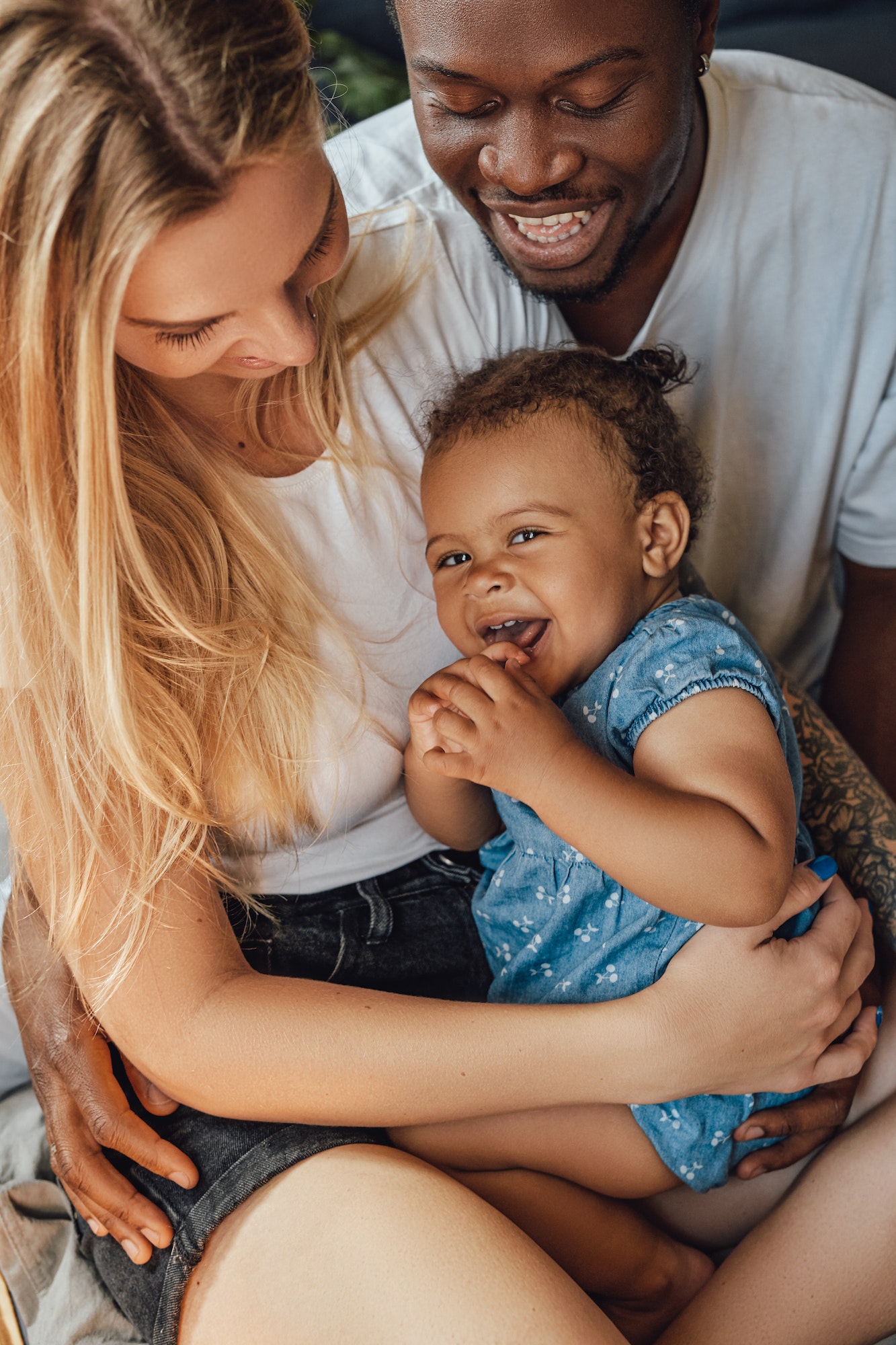 Joyful family of father mother and their daughter together